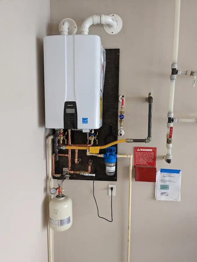 Professional plumber installing copper piping in a Mobile home